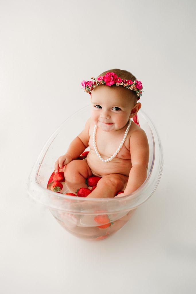 baby girl in fruit bath best photography studio indianapolis