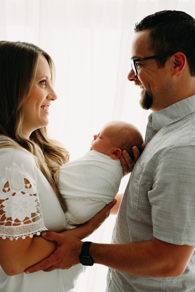 couple holding newborn Holly Marie Photography