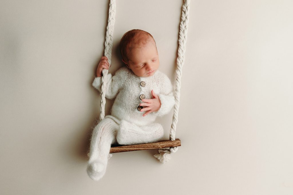 newborn on swing Holly Marie Photography