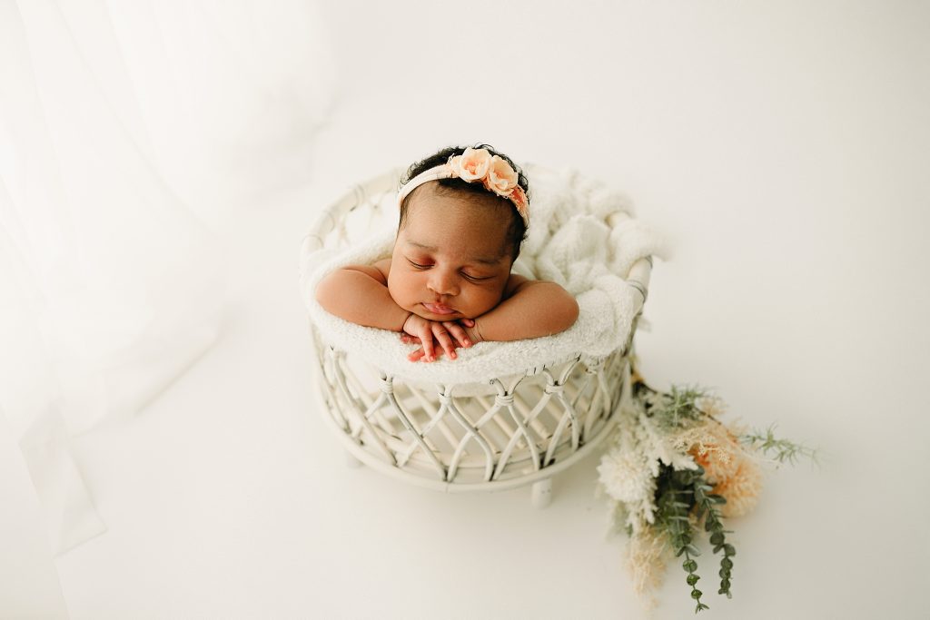 newborn girl sleeping macrame bowl