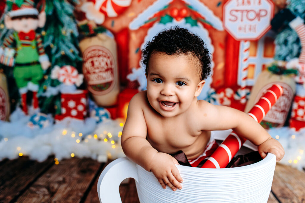 baby in Christmas cocoa mug photo