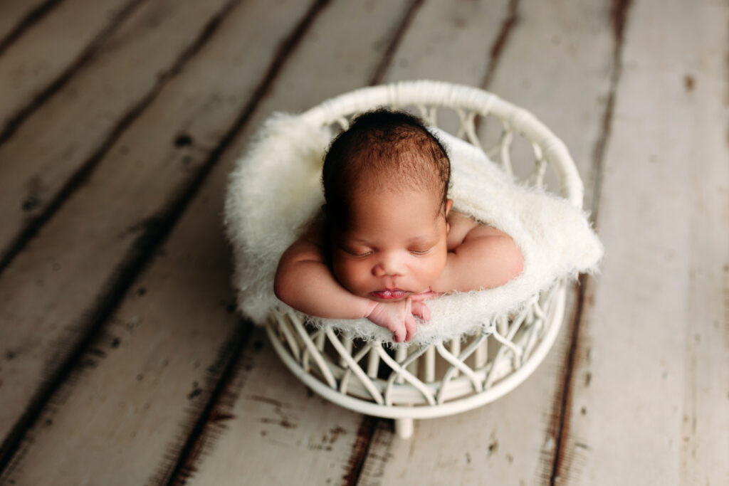 Newborn boy macrame bowl cream wood floor