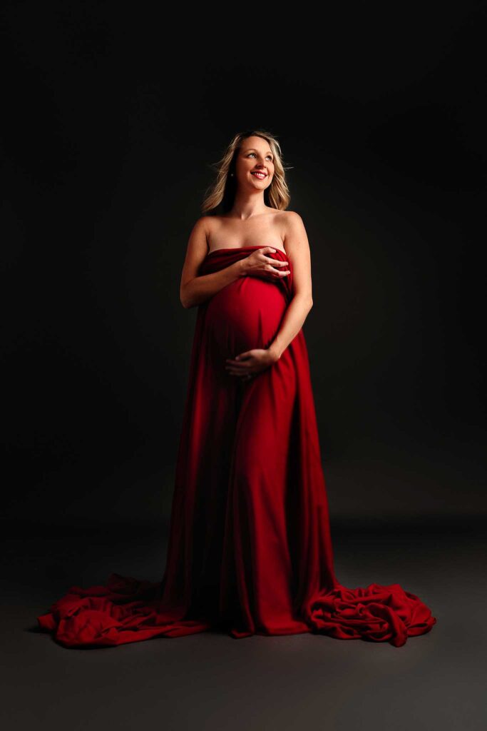 maternity model in red draping fabric