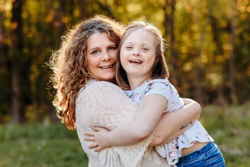 mom holding daughter down syndrome