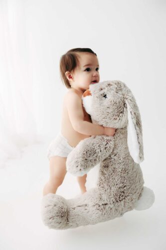 baby holding giant bunny