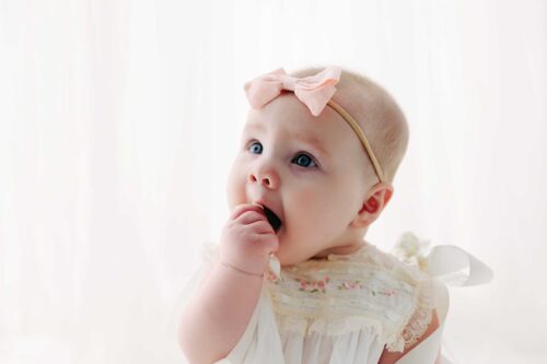 baby girl by window