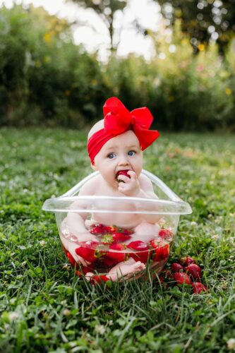 Baby in strawberry bath spring
