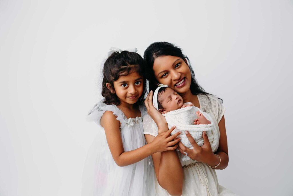 woman girl newborn wrapped