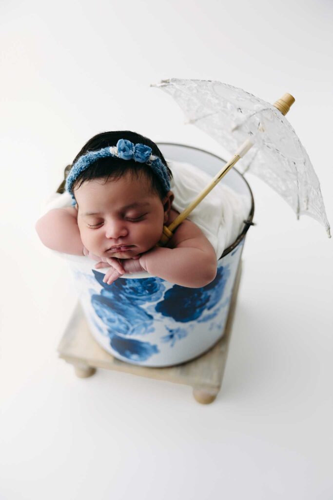 newborn girl blue floral bucket umbrella