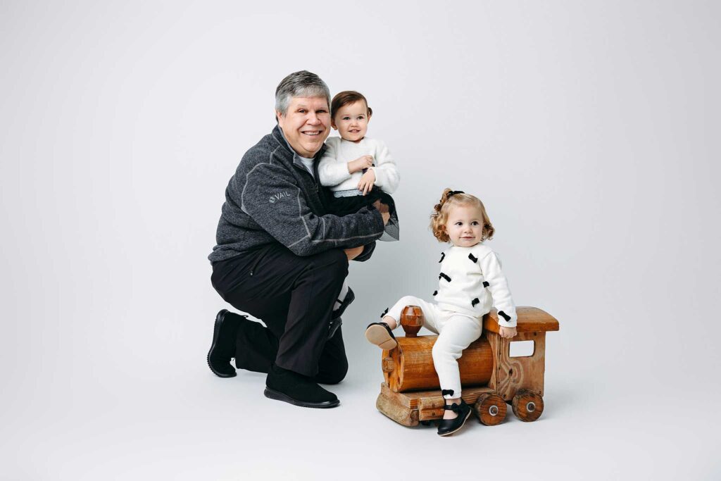 girl toy train grandfather