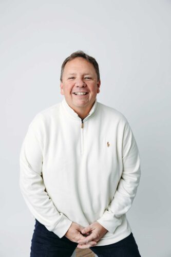 cream sweater white backdrop man