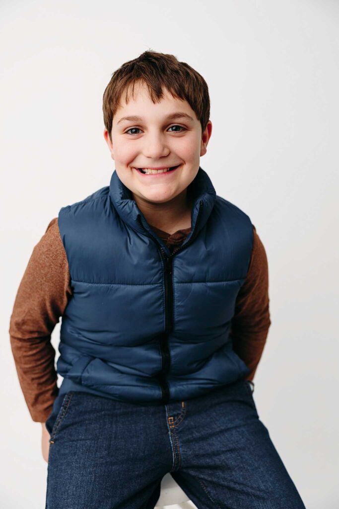 boy blue vest brown shirt