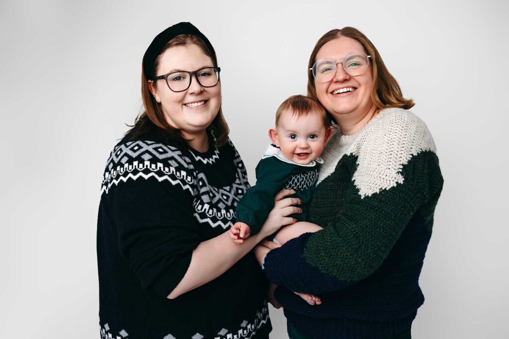 lesbian moms baby green sweater