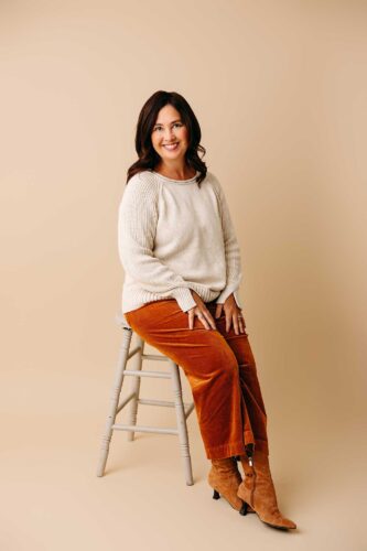 woman sitting on stool