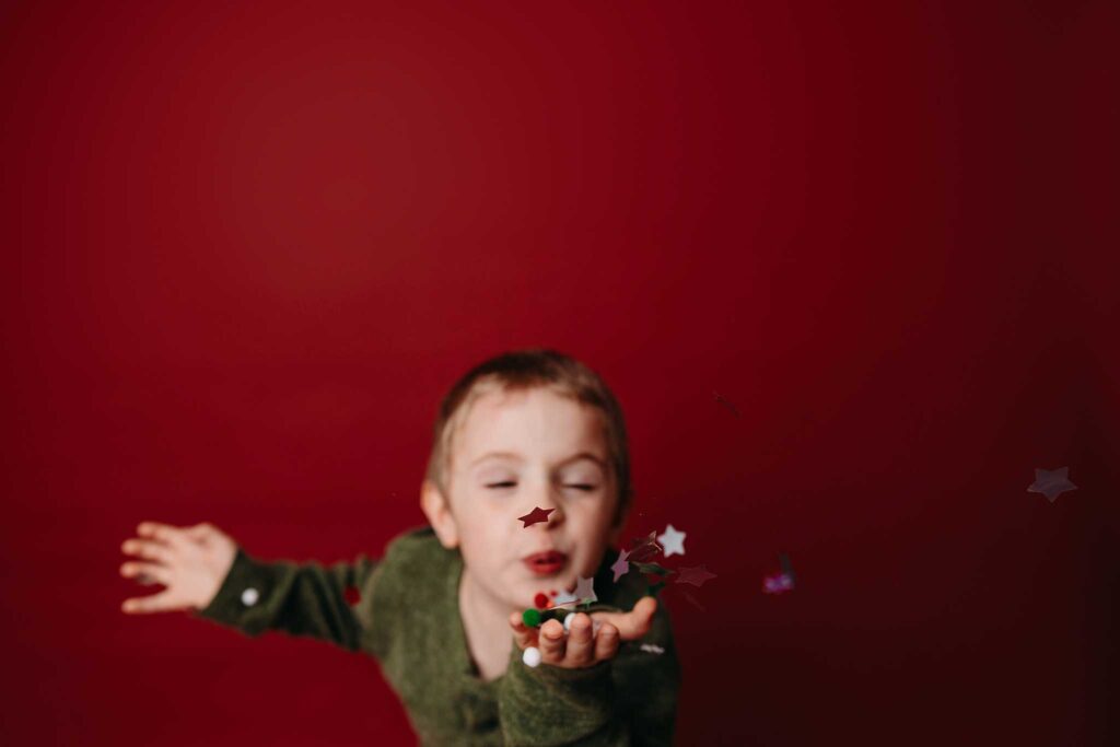 child green shirt christmas confetti